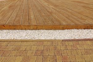 Composite Wood Decking, White Marble Gravel And Stone Brick Pavi, Backyard Dry Patio Or Terrace Surface In Perspective View.